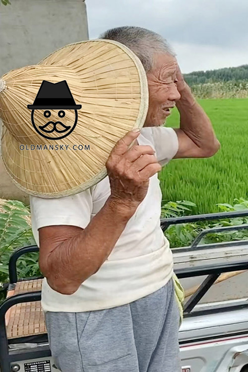 Farmer’s old man was in the field with a hat