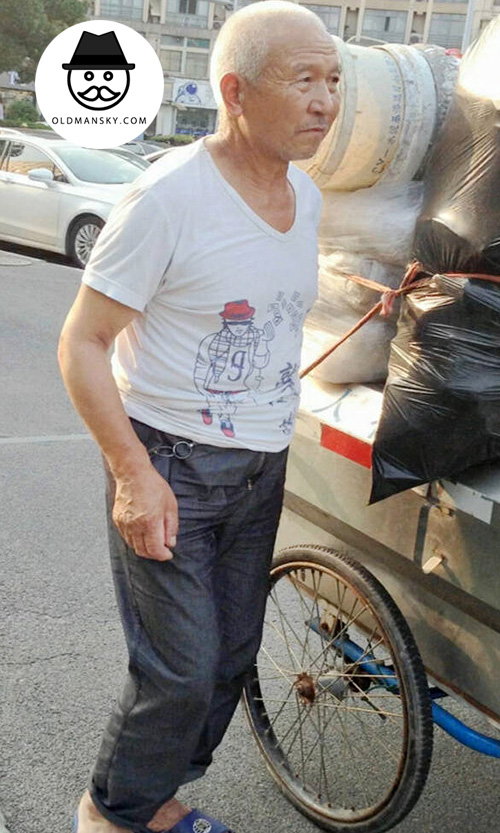 White hair old man in white T-shirt worked in the street