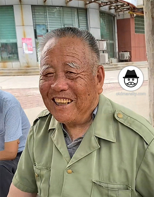 Two old men sat in the street