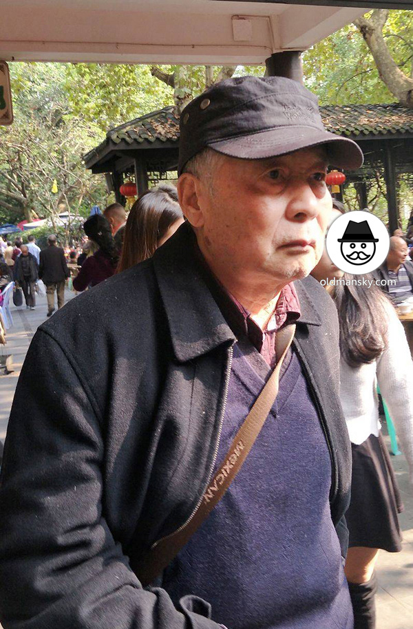 Old man wore a cap travel in the park