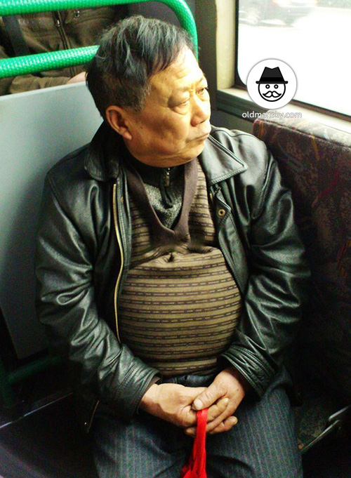 Old daddy wore black jacket coat by bus
