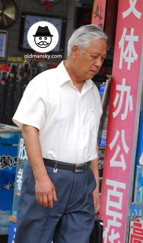 White hair old man wore white shirt and blue trousers in the street_06