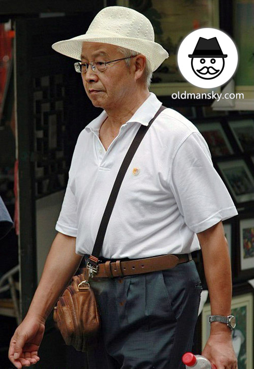 Glasses old daddy wore white polo shirt and hat in the street