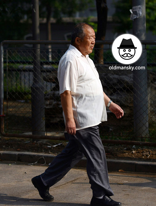 Old man wore white shirt was walking in the street_04