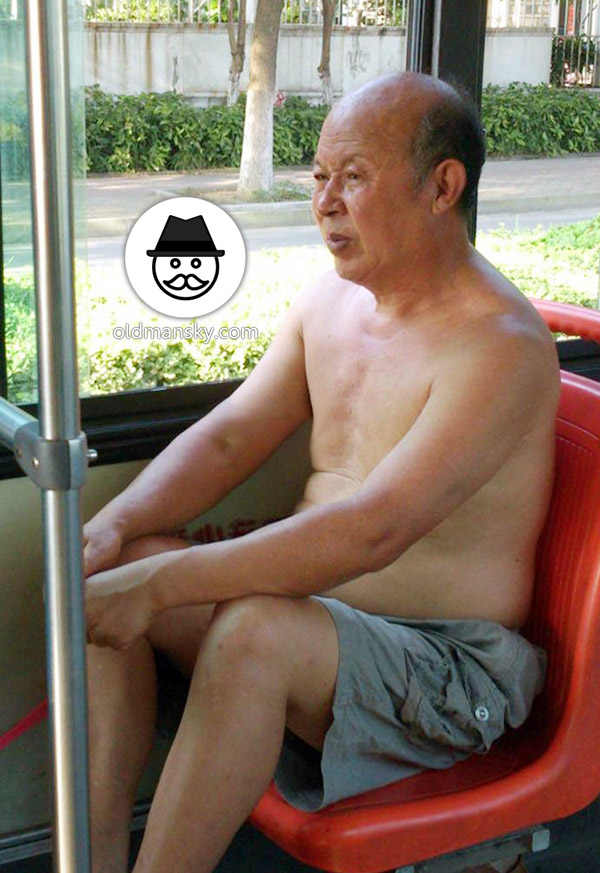 Two grey middle pants old men one by bus and other writing_04