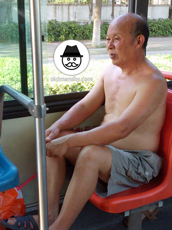 Two grey middle pants old men one by bus and other writing_05