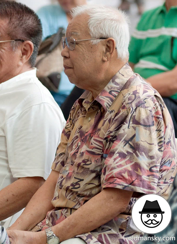 White hair glasses old man talked with his friend on the square