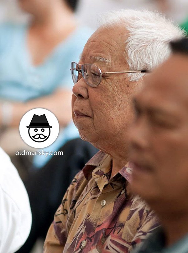 White hair glasses old man talked with his friend on the square