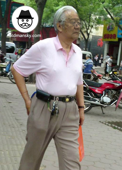 White hair glasses old man wore white polo shirt walked in the street_02