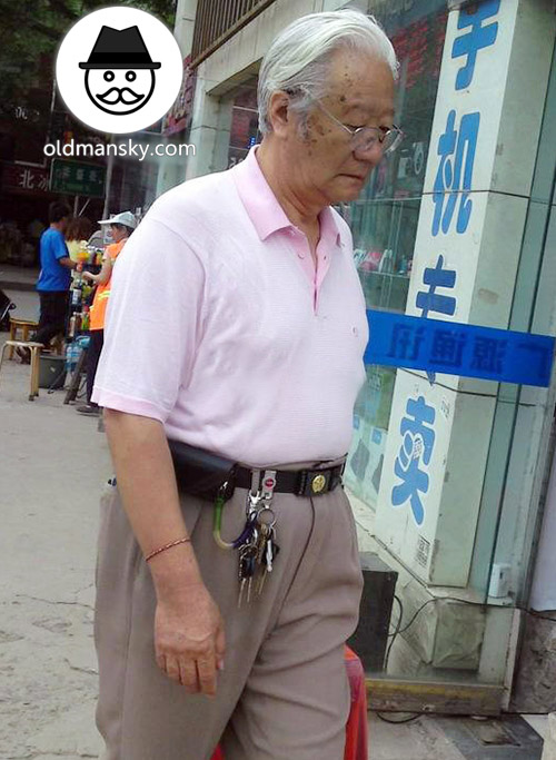 White hair glasses old man wore white polo shirt walked in the street_03