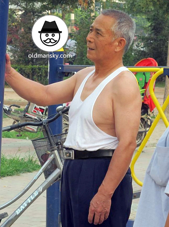 Old daddy wore white vest undershirt and brown trousers exercised