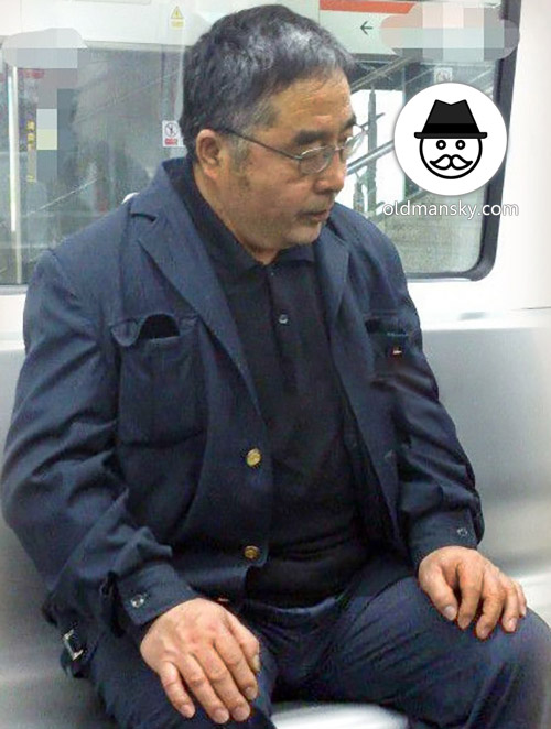 Glasses old daddy wore black suit was watching cellphone by subway