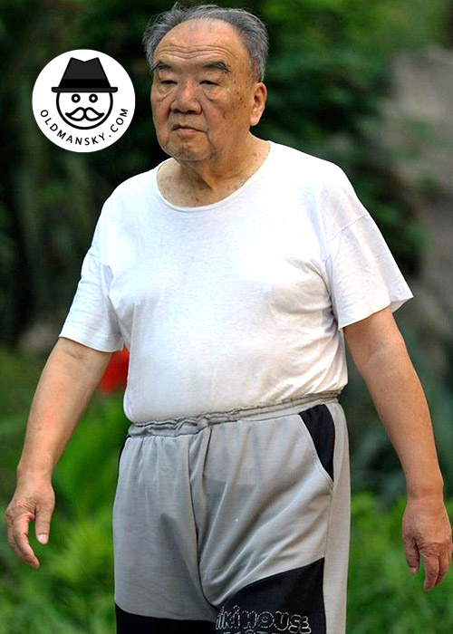 Old man wore white T-shirt and gray middle pants walked in the park_06