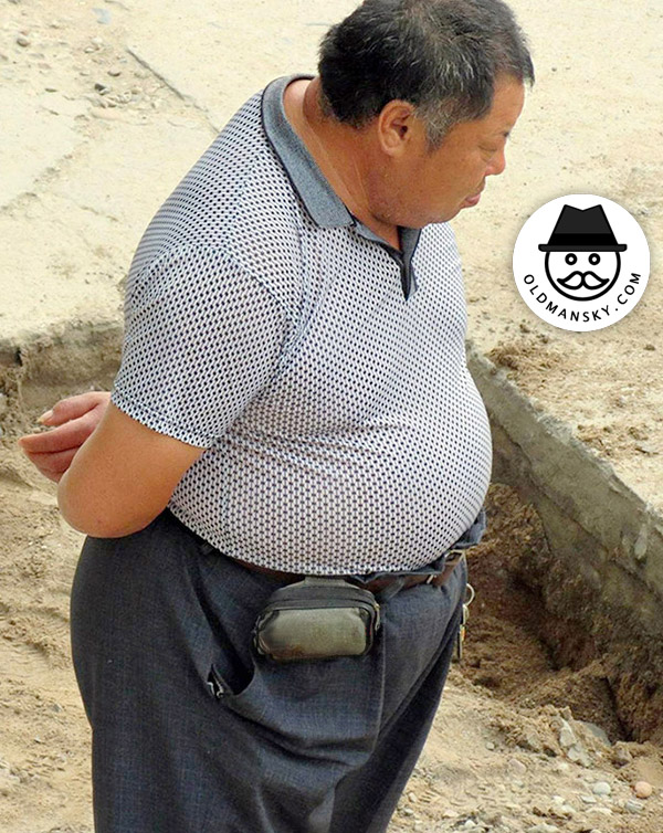Fat old daddy stood on the construction site_04