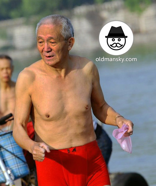 White hair old man wore a red underwear went swimming by the river