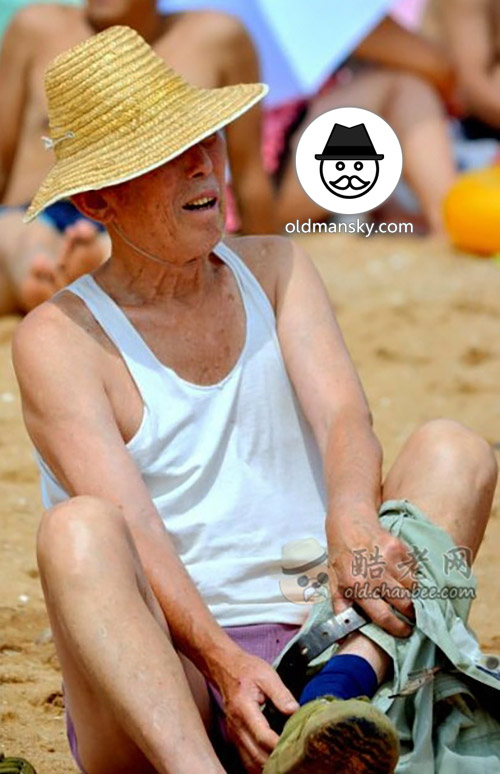 Bald head old man went swimming on the beach