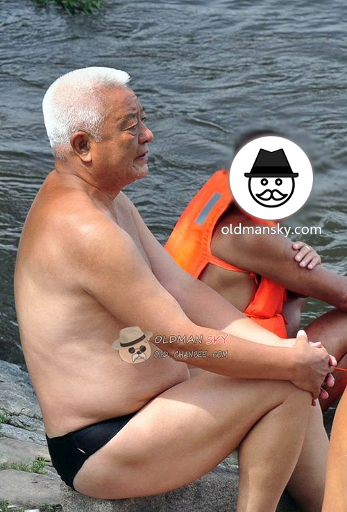 White short hair swimming old man wore a black underwear by the lake